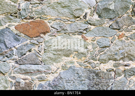 Frammento di antico borgo medievale sassoso parete (fondo) Foto Stock