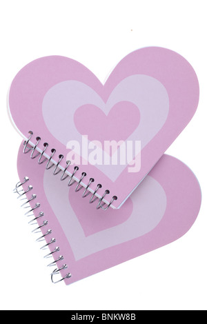 Due a forma di cuore i notebook rosa Foto Stock