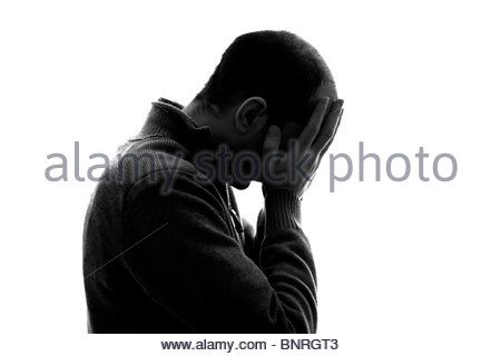 Stagliano Uomo con testa in mani Foto Stock