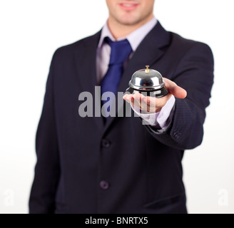 Cameriere tenendo un hotel bell Foto Stock