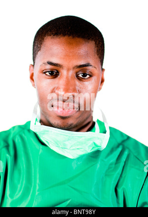 Senior chirurgo in scrub verde Foto Stock