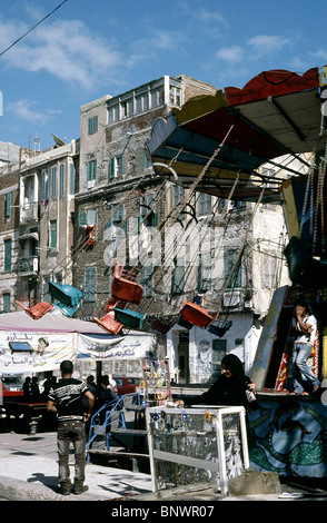 Sedia-O-piani ad un luna park su Midan Maseged (Moschea Square) nel centro di Alessandria. Foto Stock