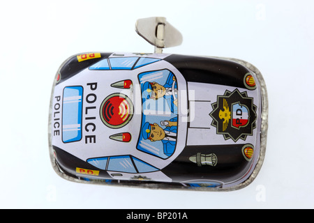 Tin Toy, pattuglia di polizia, avvolgere il tasto per attivare il motore meccanico. Foto Stock