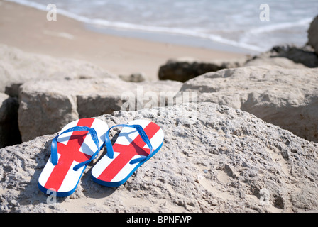 Inghilterra flip flop in spiaggia Foto Stock