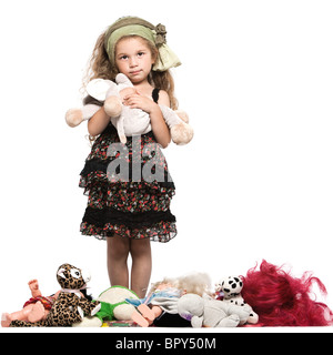 Caucasian bambina con giocattoli studio isolato su sfondo bianco Foto Stock