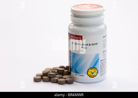 St Johns Wort e 5HTP complesso integratore alimentare vitamina pillole e contenitore. Per ridurre i sintomi della menopausa Foto Stock