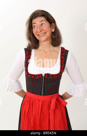 Donna di mezza età che indossa un vestito con grembiule, abito tradizionale Foto Stock