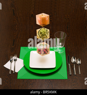 Cibo galleggiante blocchi per mostrare la costruzione di blocchi di vostra dieta. Foto Stock