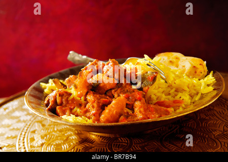 Tradizionale Indiano curry di agnello con riso pilaf Foto Stock