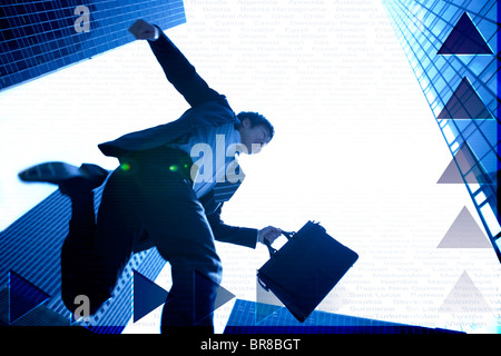 Businessman jumping Foto Stock