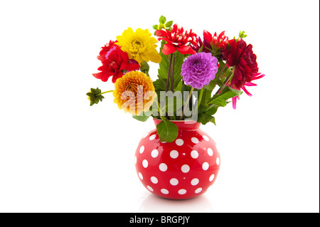 Bouquet con colorate diverse dalie in rosso vaso punteggiata Foto Stock