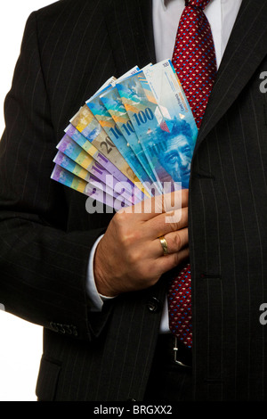 Manager, franco svizzero note nella sua mano Foto Stock