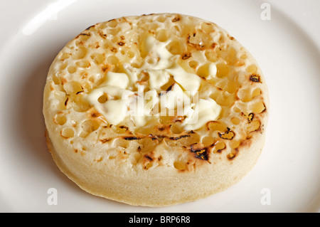 Tostato crumpet imburrato Foto Stock