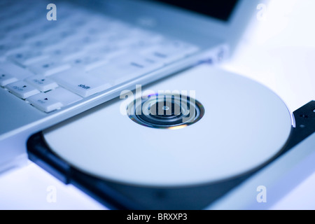 Laptop e CD Foto Stock