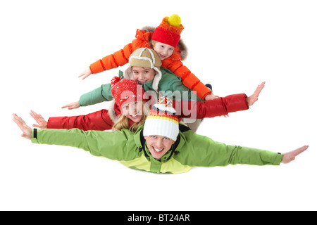 La famiglia felice membri guardando la fotocamera con sorrisi e le loro braccia tese Foto Stock