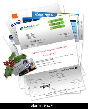 Elettrodomestici e fatture per carte di credito con carte di credito e di Natale holly Foto Stock