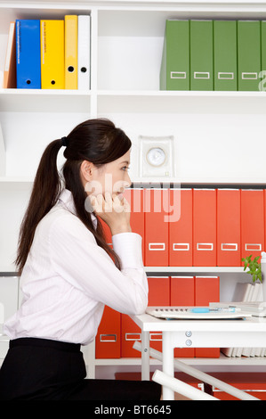 Imprenditrice seduta Foto Stock