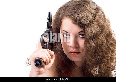 Giovane donna con una pistola. Isolato su bianco Foto Stock