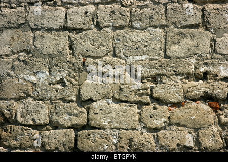 Foto di un frammento di un muro di pietra Foto Stock