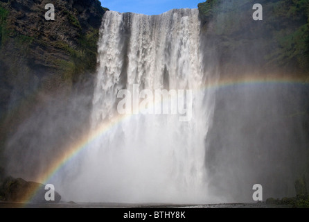 Skogafoss rainbow spray Foto Stock