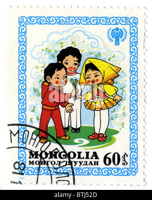 MONGOLIA - circa 1980: un timbro stampato in Mongolia mostra immagine del bambino, circa 1980. Foto Stock