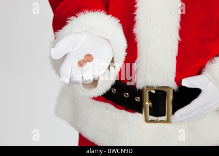 Stati Uniti d'America, Illinois, Metamora, sezione mediana di Santa Claus holding delle monete in euro Foto Stock