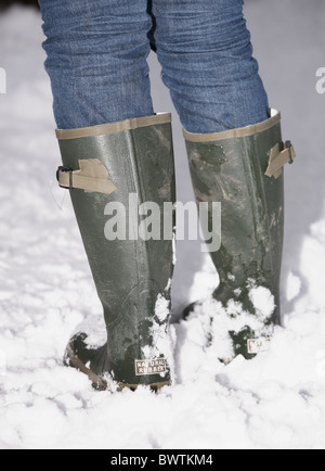 Stivali da pioggia nella neve Foto Stock