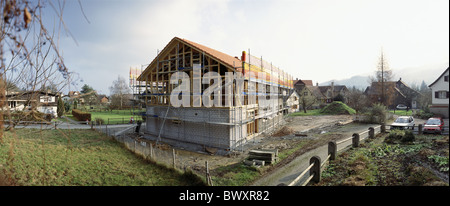 Costruzione casa case case industria impalcatura di costruzione sito di costruzione di una casa di famiglia abitazione Foto Stock