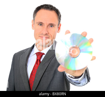 Attraente businessman holding dvd. Tutto su sfondo bianco. Foto Stock