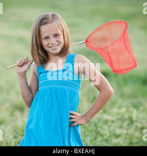 Giovane ragazza con una farfalla net Foto Stock