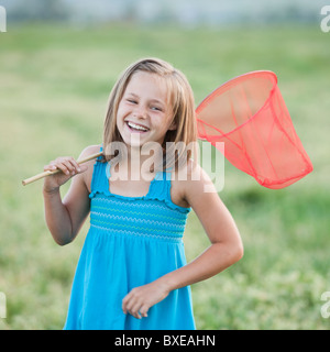 Giovane ragazza con una farfalla net Foto Stock