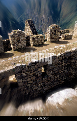 Edifici del settore industriale all'UNESO Patrimonio Mondiale rovine Inca di Machu Picchu - Valle Sacra, Perù. Foto Stock