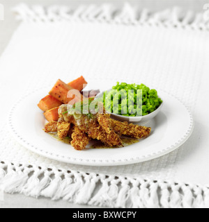 Coujons di pollo con miele di medicazione di senape Foto Stock