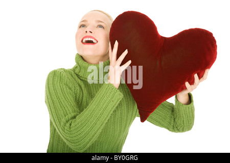 Donna con cuore-cuscino sagomato Foto Stock