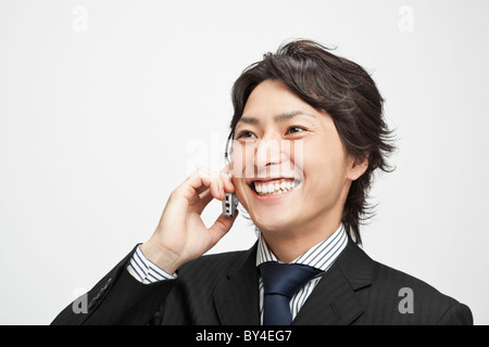 Imprenditore sul telefono cellulare Foto Stock