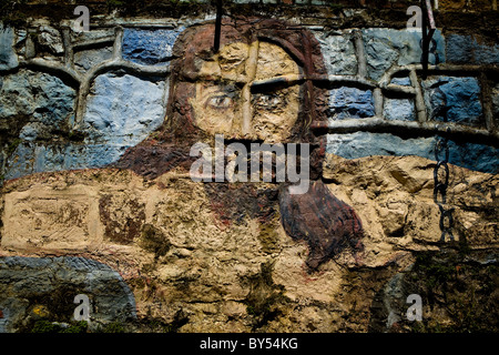 Pittura di Gesù Cristo su un muro di mattoni a Barichara, Colombia Foto Stock