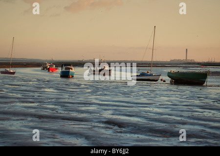 Barche sulle velme al tramonto Foto Stock