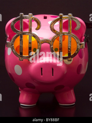 Polka Dot Salvadanaio con segni di dollaro Foto Stock