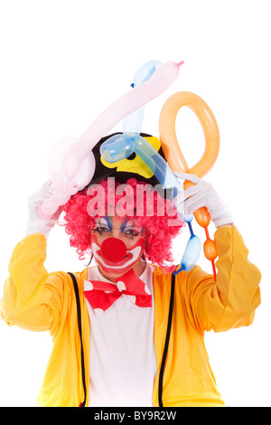 Funny clown in piedi su sfondo bianco Foto Stock