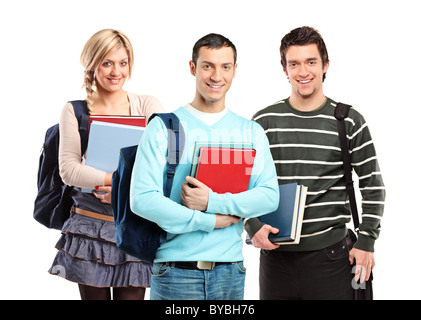 Tre studenti che posano con libri isolato su bianco Foto Stock