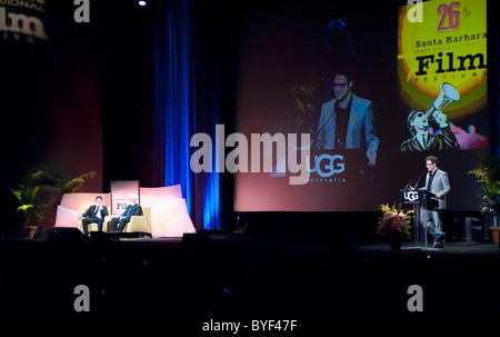 127 ore star, James Franco, sul palco con il critico cinematografico Leonard Maltin, ridendo a Seth Rogen's tribute Foto Stock