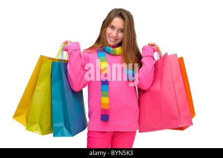 Bella ragazza giovane con sacchetti colorati isolato in bianco Foto Stock