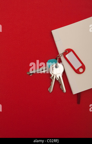 Keyring e notebook, rosso Foto Stock