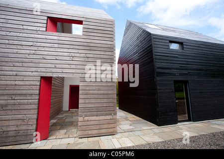 Rivestito di legno elevazione laterale di scorrimento della casa nel Suffolk in Inghilterra. Foto:Jeff Gilbert Foto Stock