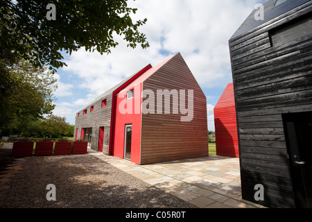 Esterno rivestito di legno fienili lo scorrimento House Suffolk in Inghilterra. Foto:Jeff Gilbert Foto Stock