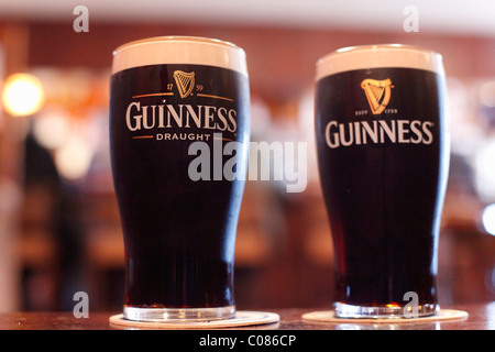 Pinte di Guinness Birra stout, Irlanda Isole britanniche, Europa Foto Stock