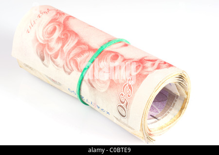 Denaro arrotolato con Uk cinquanta pound note Foto Stock