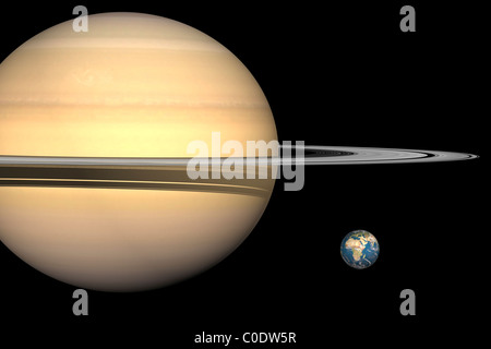 Illustrazione di Saturno e la terra in scala. Foto Stock