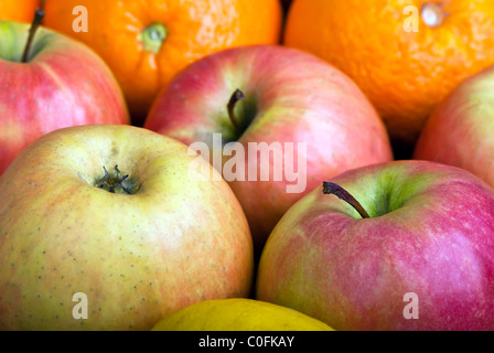 Molte le mele e arance di close-up di sfondo macro Foto Stock