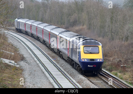 Primo grande Western di treno sulla linea di Cotswold durante la via il raddoppio, Charlbury, Oxfordshire, Regno Unito Foto Stock